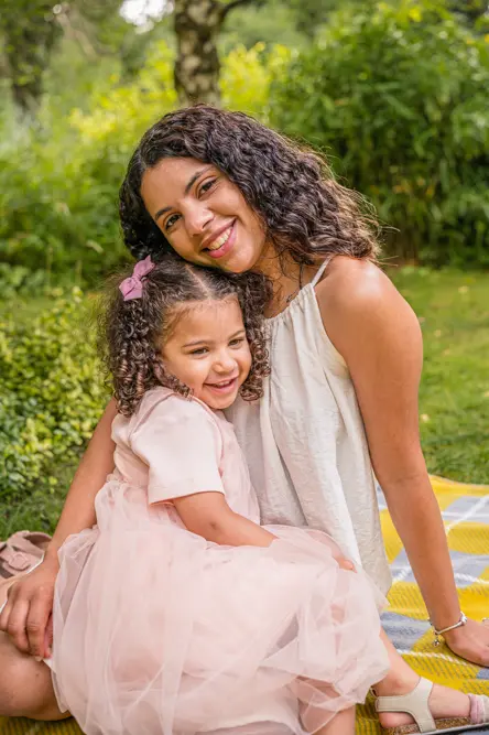 Outdoor Family Portrait of young daughter with Mum