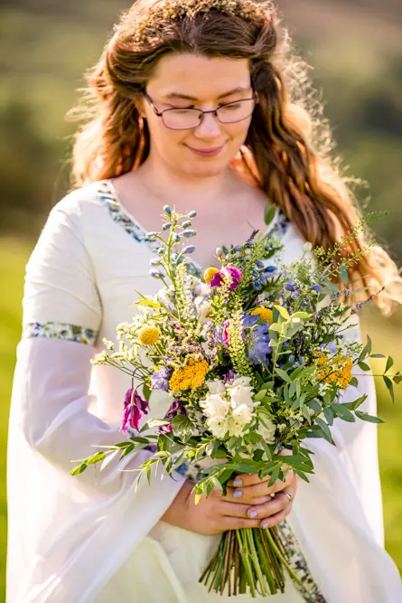 Bride looking down at her flowers