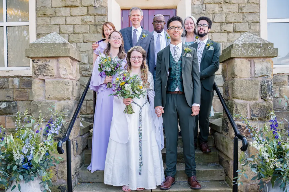 Bride and groom with both families outside Peel Street Baptist Church, Accrington