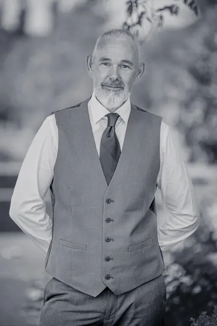 Black-and-white image of Close-up of man wearing a tie and waistcoat