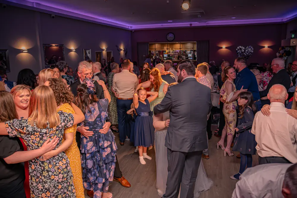 Wedding guests dancing on the dance floor