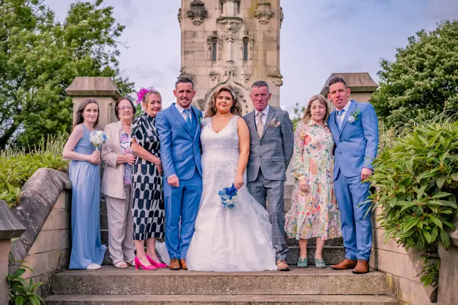 Family group photograph at whitehead garden, bury after a wedding ceremony.