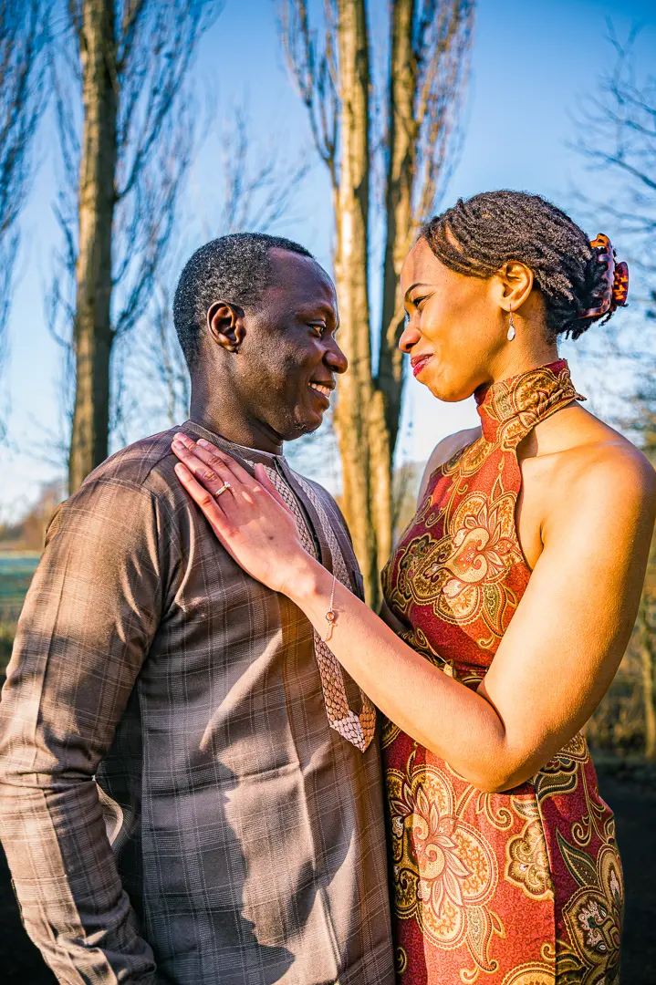 Bea and Abraham embracing during engagement portraits at Fletcher Moss Gardens.