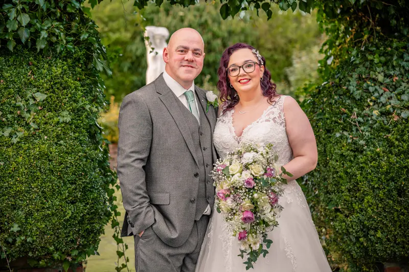 Sean and Claire's Wedding at Mercure Bolton Georgian House Hotel Wedding couple portrait in the gardens at Mercure Bolton Georgian House Hotel, Bolton wedding photographer Rebekah Morecroft