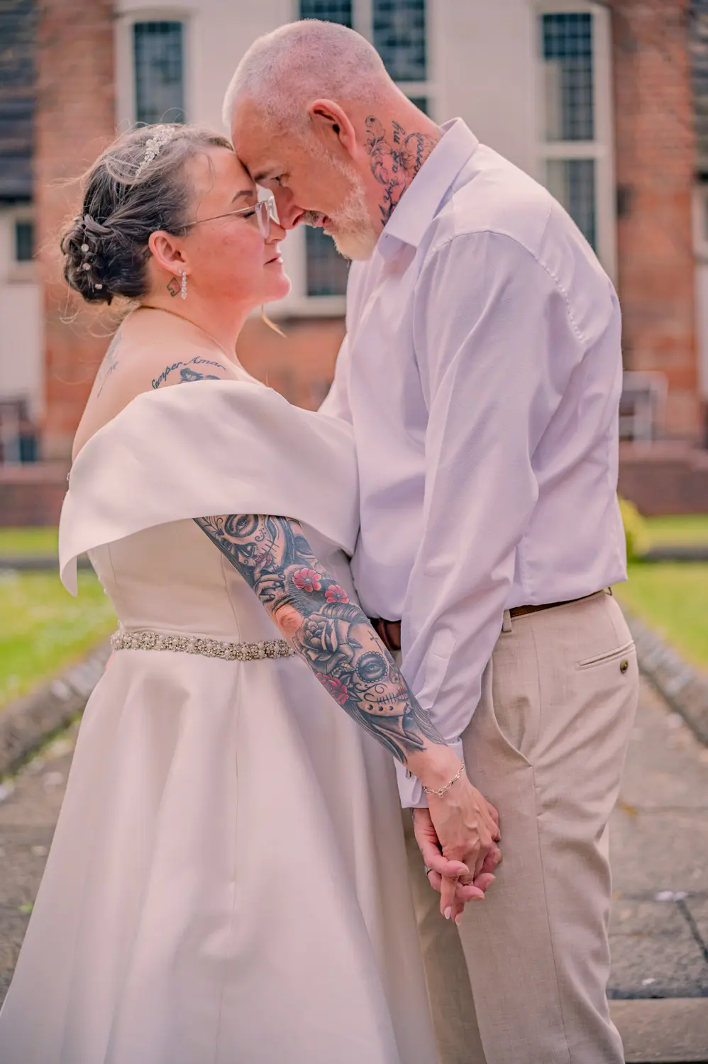 Close couple portrait of the bride and groom as the evening light softens