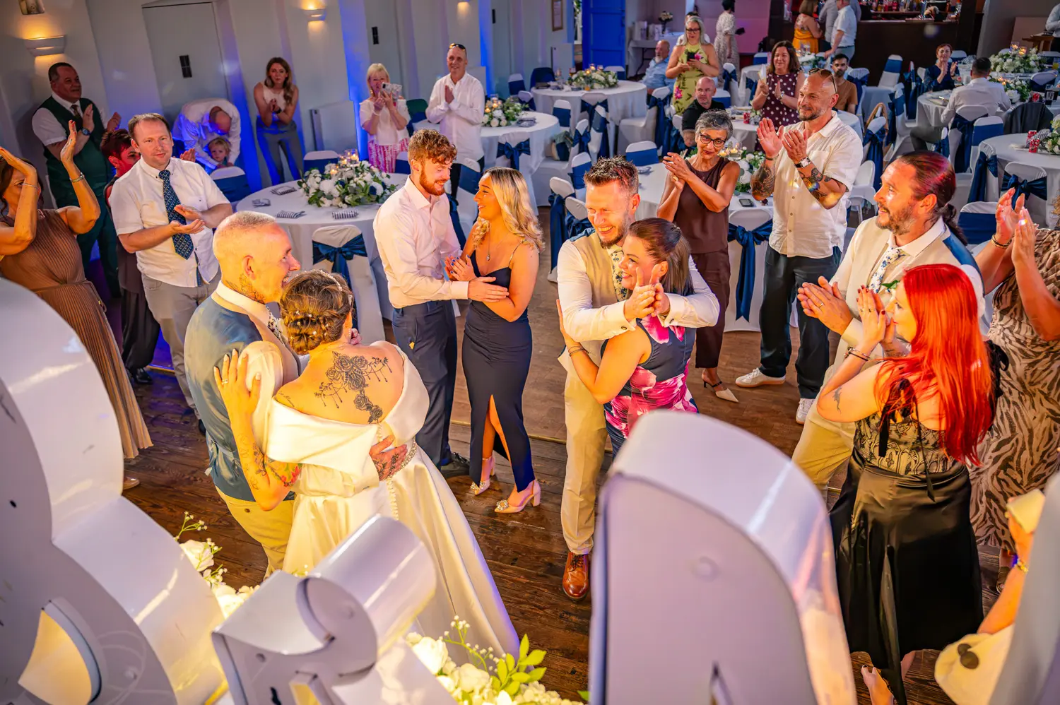 Wedding guests joining the bride and groom on a crowded dance floor