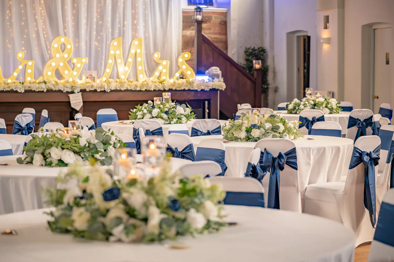 Close detail of the table styling, glassware, and place settings