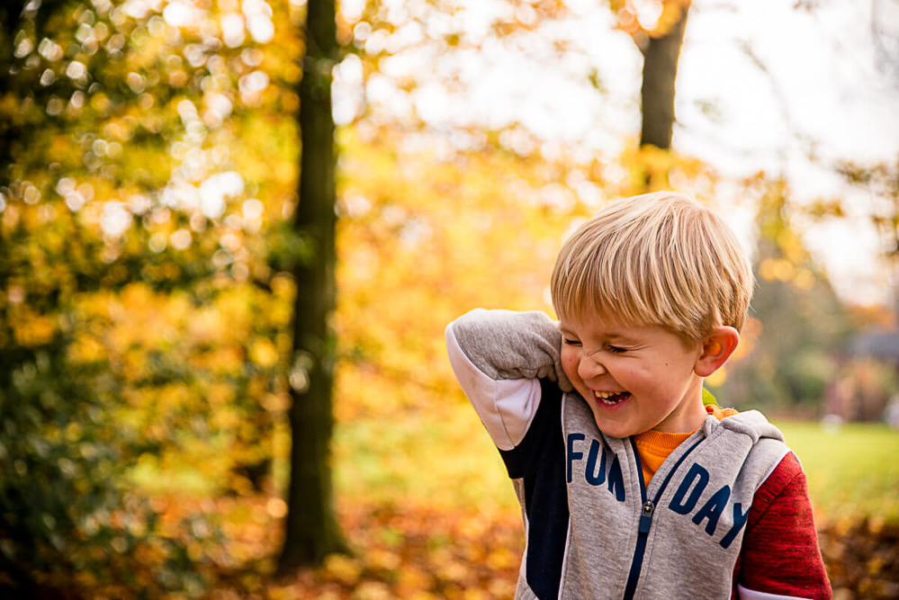 Outdoor Family Portrait of young boy laughing