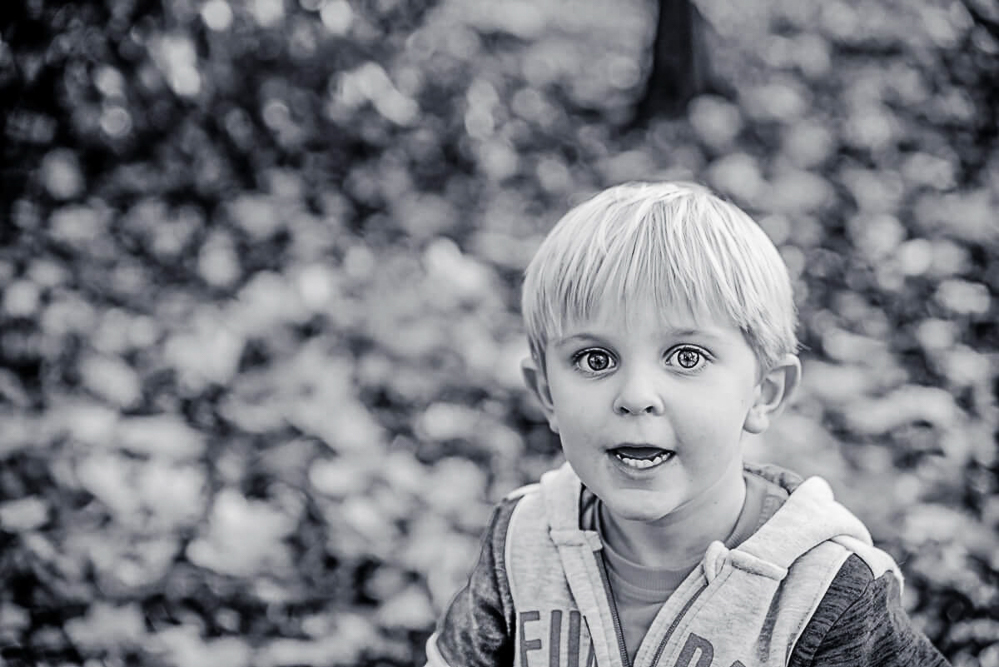 Outdoor Family Portrait of young boy in black and white