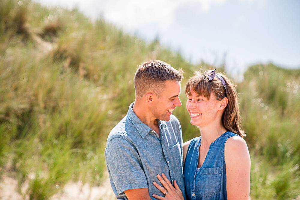 Outdoor Family Portrait of couple looking at each other on the beach