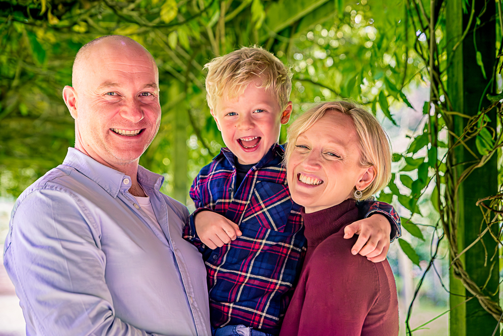 Outdoor Family Portrait of family of 3 laughing