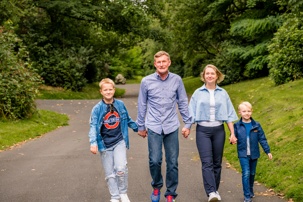 Outdoor Family Portrait of family of 4 walking holding hands