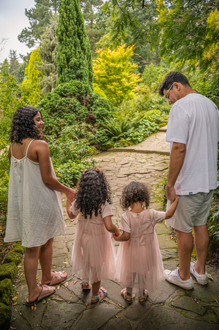 Outdoor Family Portrait of the backs of a young family of 4