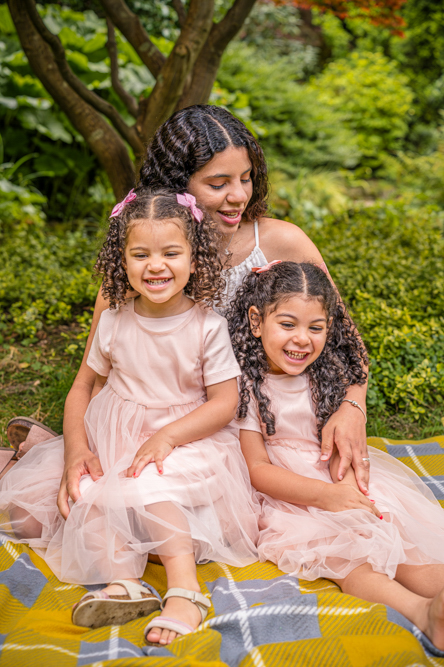 Outdoor Family Portrait of 2 young daughter with Mum