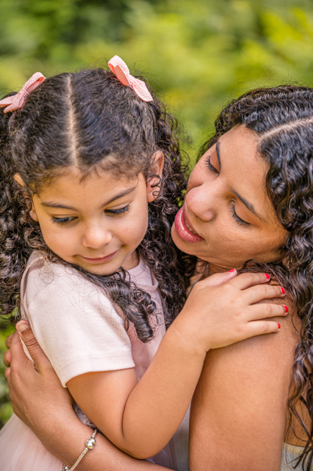 Outdoor Family Portrait of young daughter with Mum