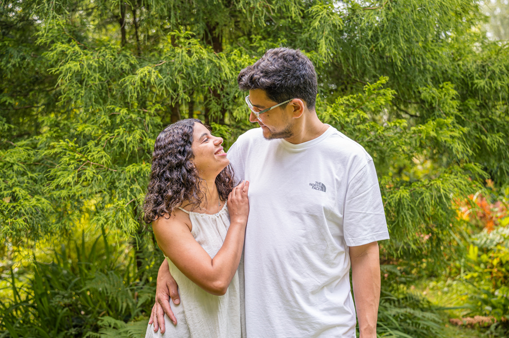 Outdoor Family Portrait of parents smiling at each other