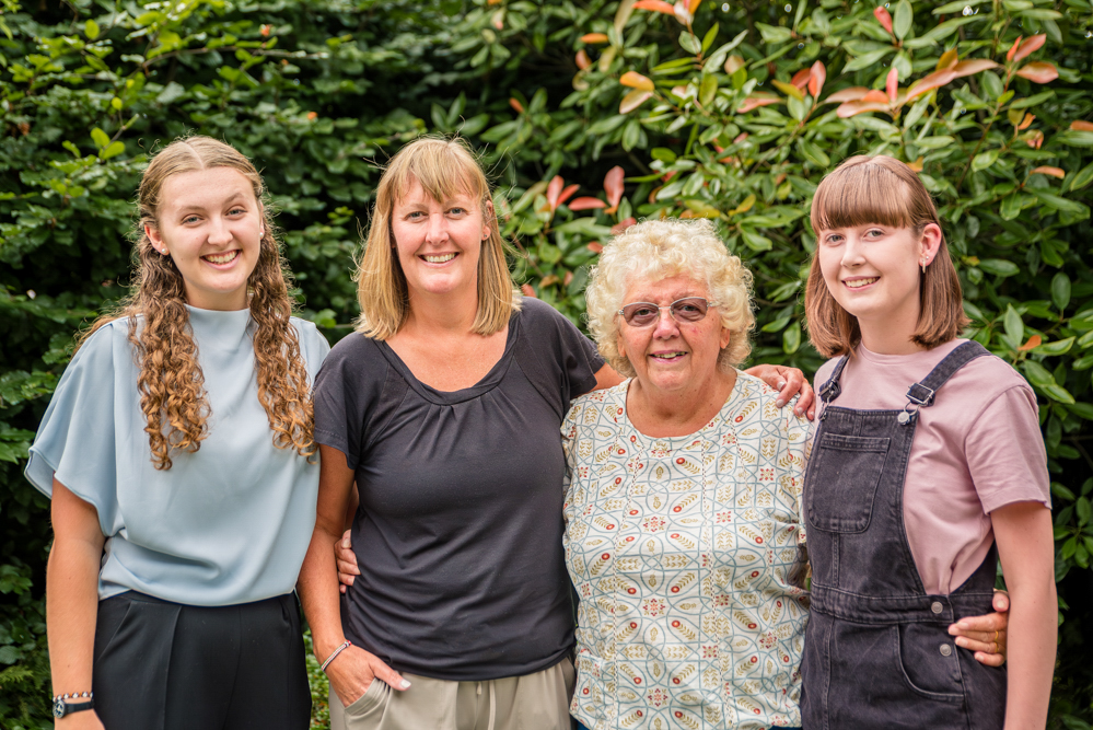 Outdoor Family Portrait of family of three with Grandma