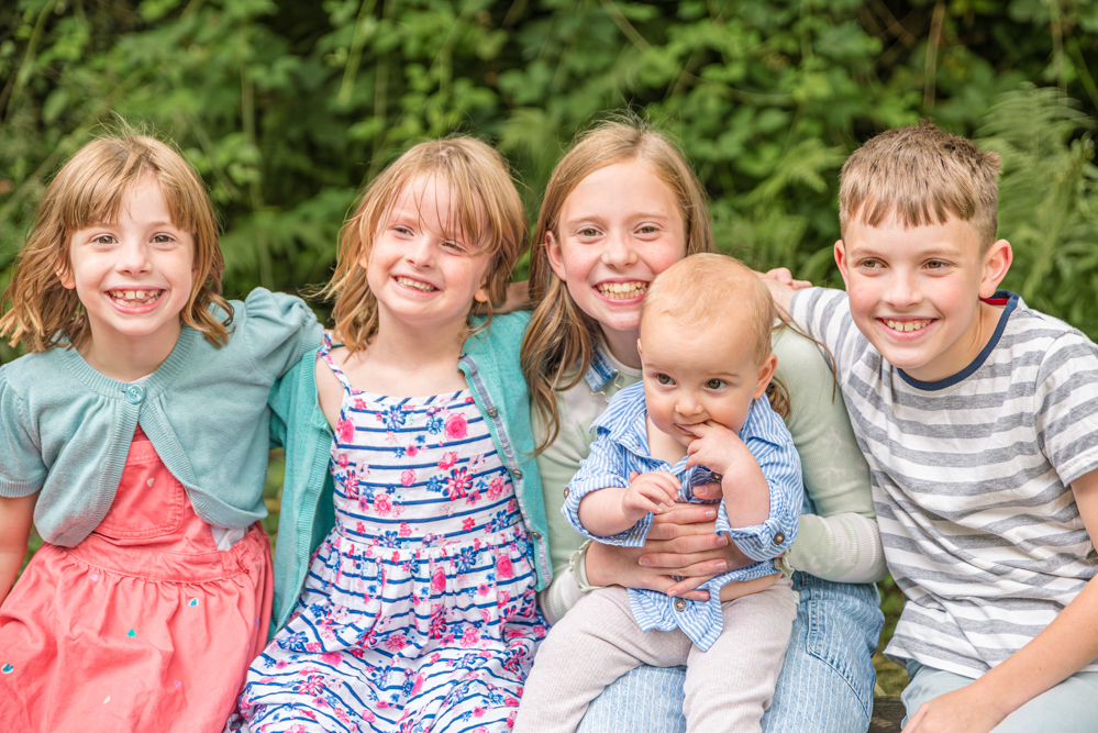 Outdoor family portrait of five siblings, family photographer new mills