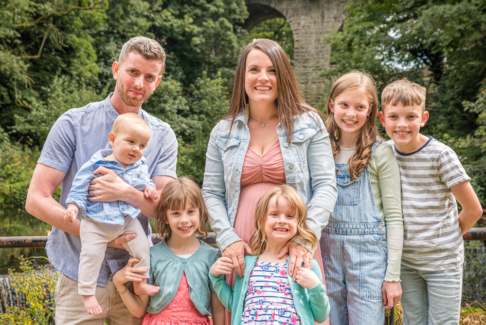 Outdoor Family Portrait of young family of 7 taken by Family Portrait Photographer