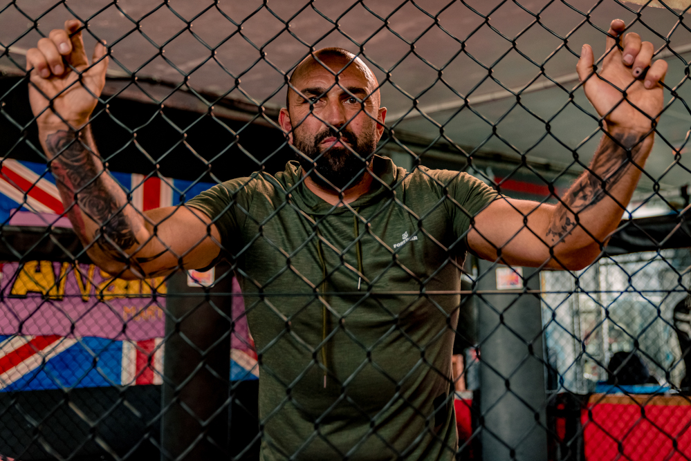Man inside UCF cage taken by Personal Branding Photographer
