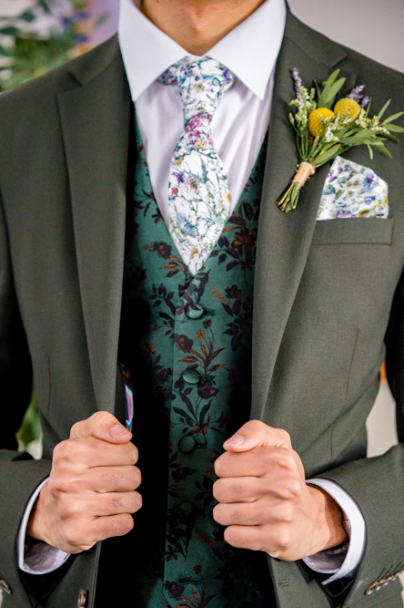 close up of groom’s suit