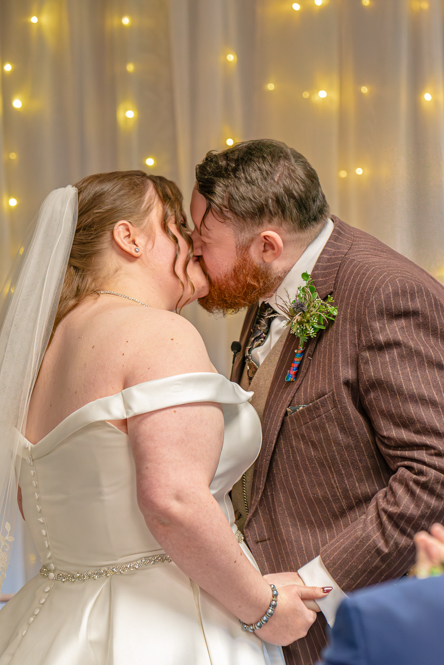 bride and groom’s first kiss