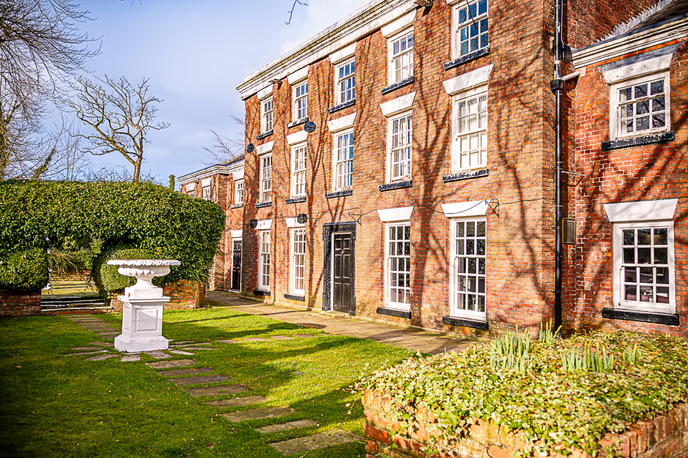The front of Mercure Bolton Georgian House Hotel a Georgian style building and garden
