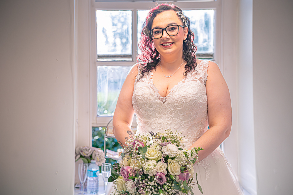 Bride and her Bouquet with window behind