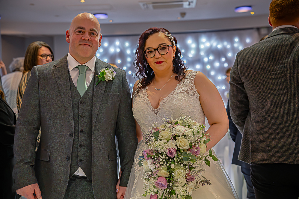 Bride and Groom walking down the aisle.