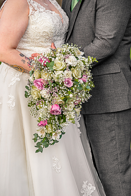 Close up of Bride and Groom holding each other