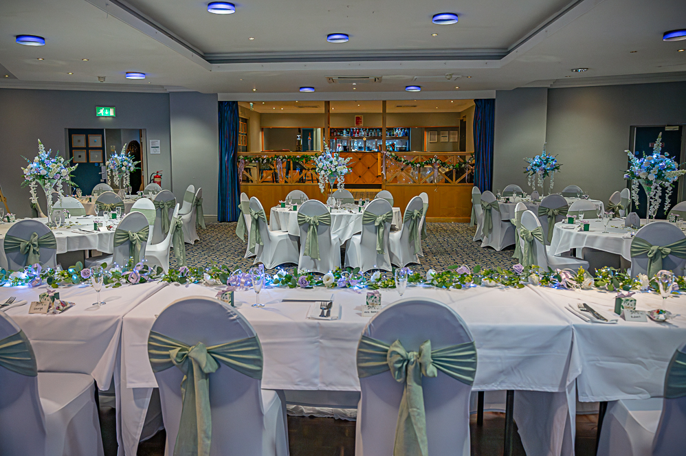 View of the wedding reception including top table and view of centre pieces.