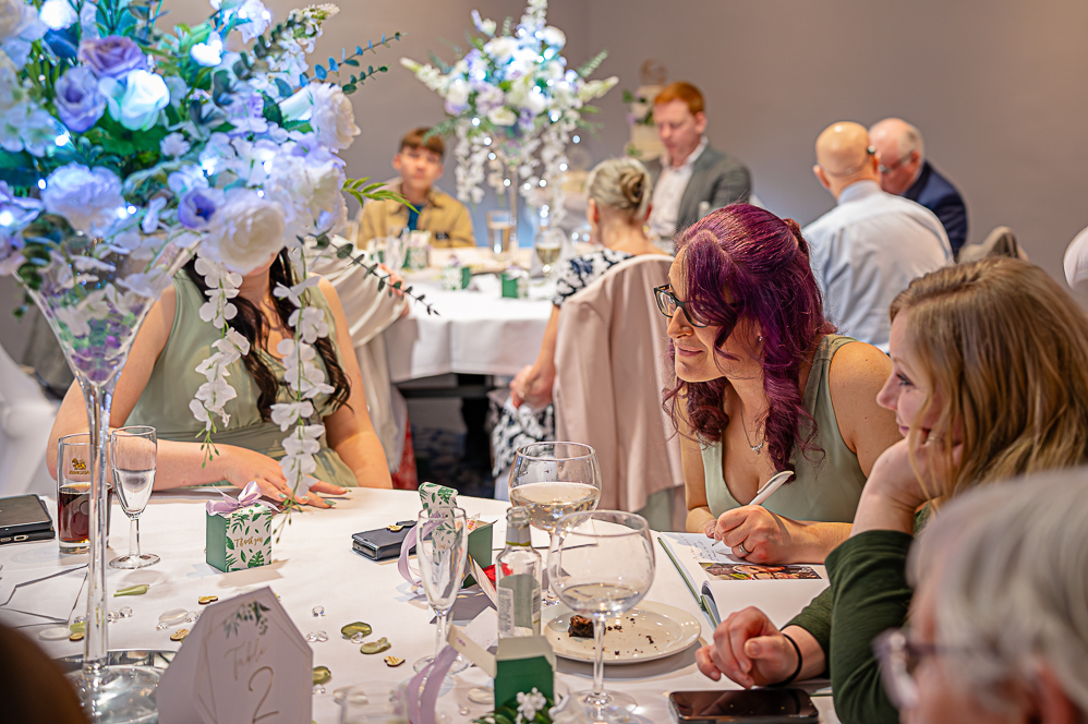 Group of wedding guests at table