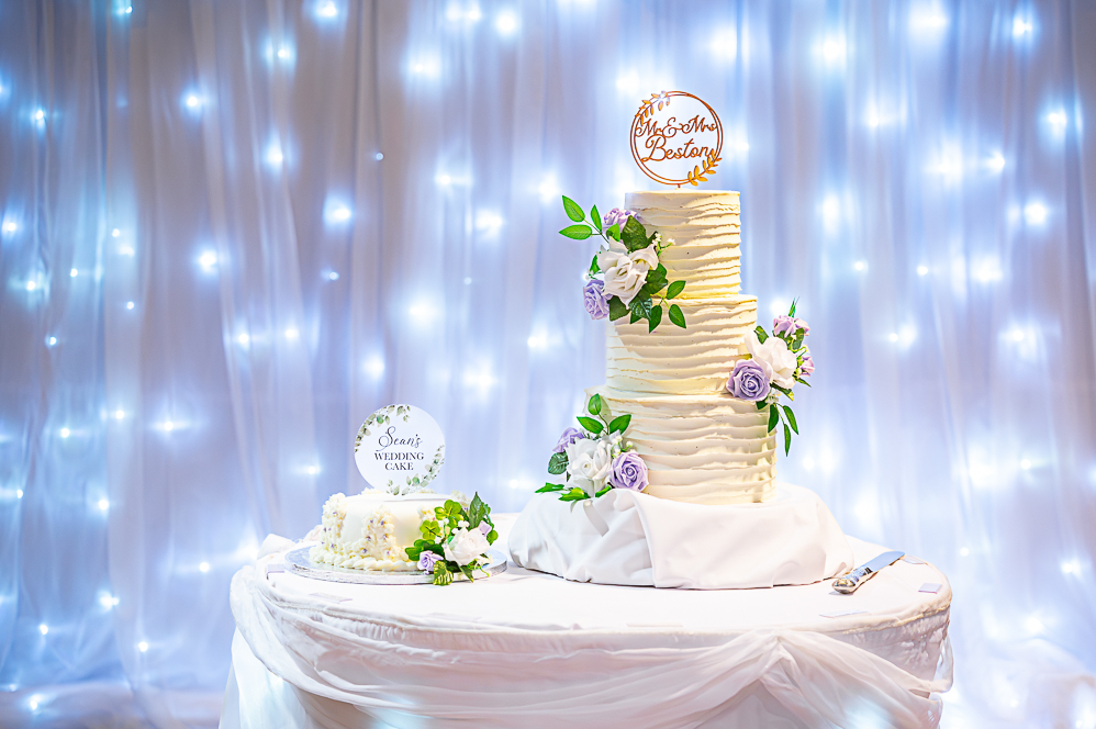 Wedding cake next to grooms wedding cake