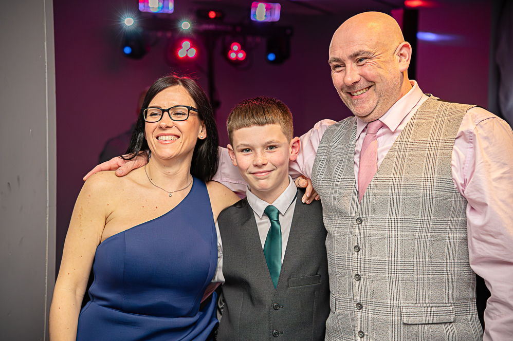 Woman, boy and Man portrait picture in wedding attire.
