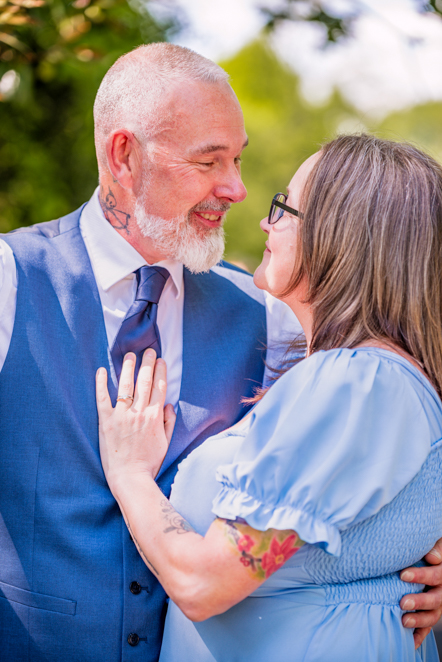 Close-up of couple with ladies hands resting on man's chest showing off her engagement ring taken by Manchester Photographer Wedding Rebekah Morecroft