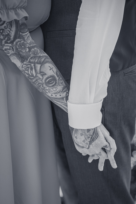 Black-and-white image of Close up of a couple holding hands
