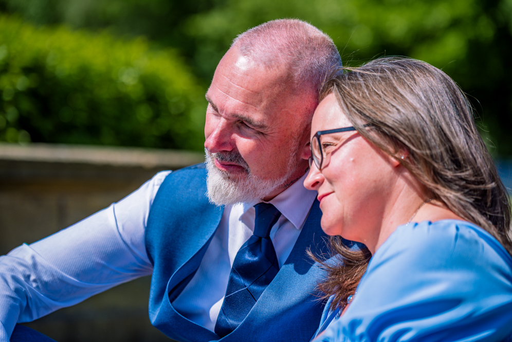 Close-up of Couple sitting closely together on some steps