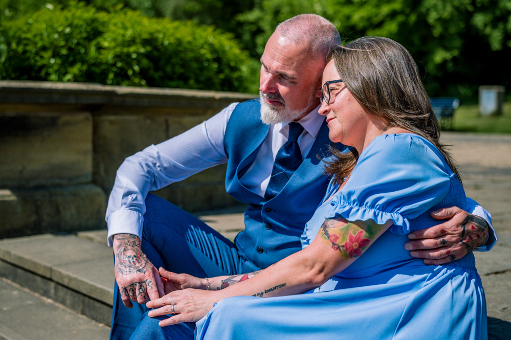 Couple sitting closely together on some steps