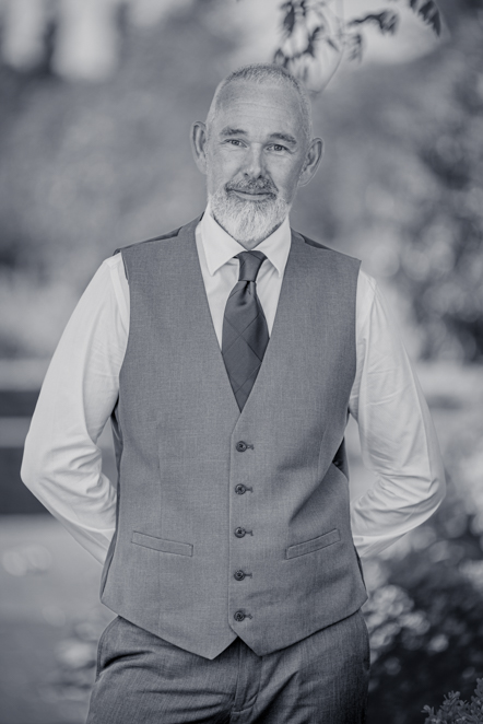 Black-and-white image of Close-up of man wearing a tie and waistcoat