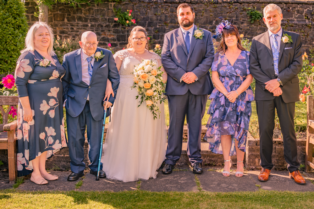 Bride and groom with both sets of parents