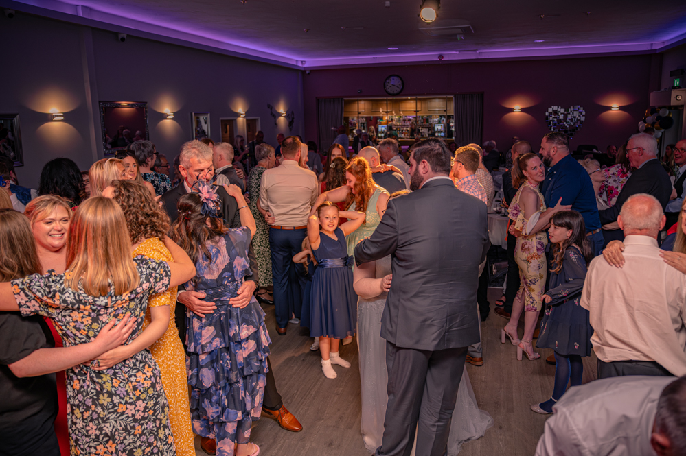 Wedding guests dancing on the dance floor
