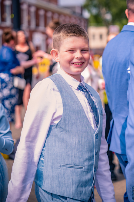 Page boy with guest in the background