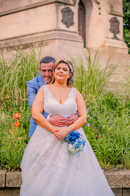 Groom giving a hug from behind the bride