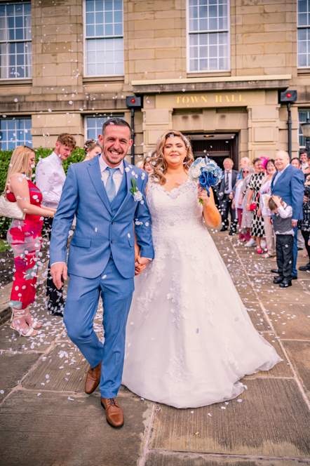 Confetti celebration outside Bury Town Hall after a registry office wedding.
