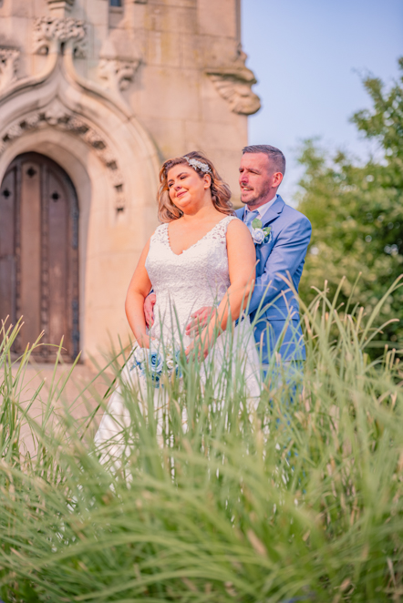Aaron and Lauren during couple portraits at Whitehead Garden in Bury.