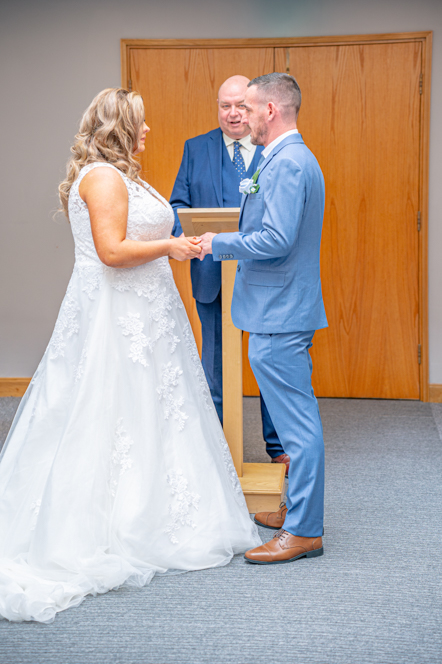 Couple standing together during their Bury Registry Office wedding ceremony.