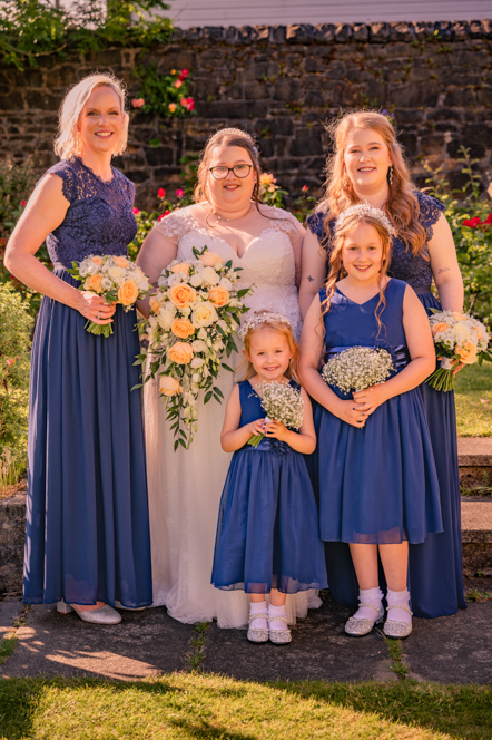 Bride with bridesmaids and flower girls at Bury wedding