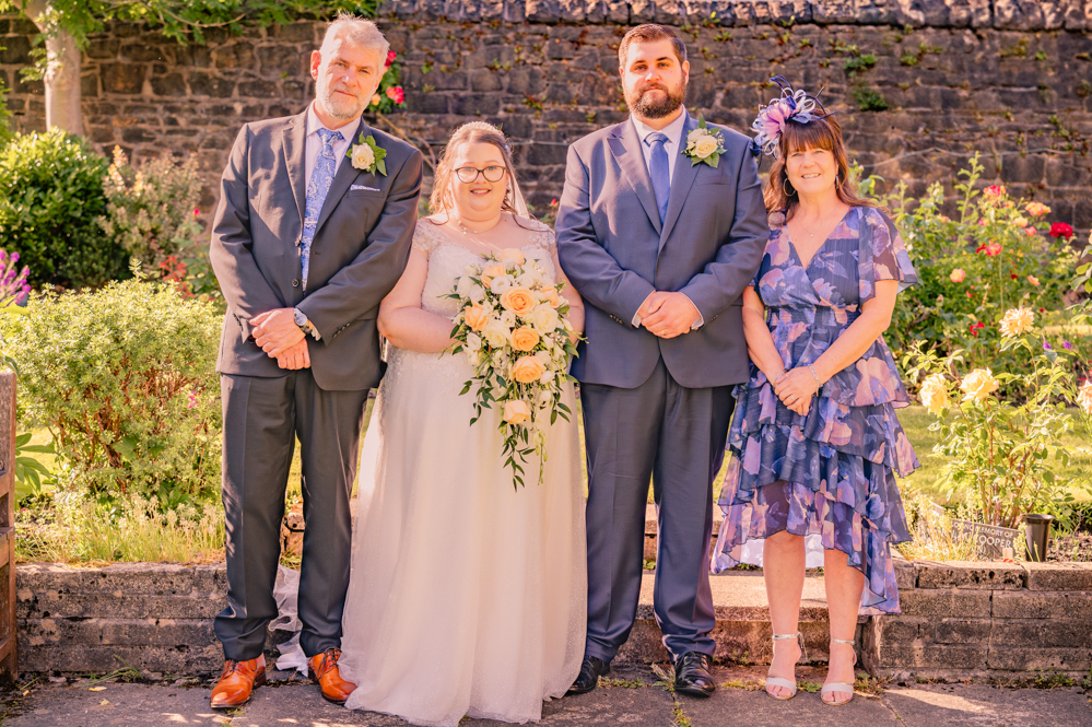 Bride and groom with the grooms parents
