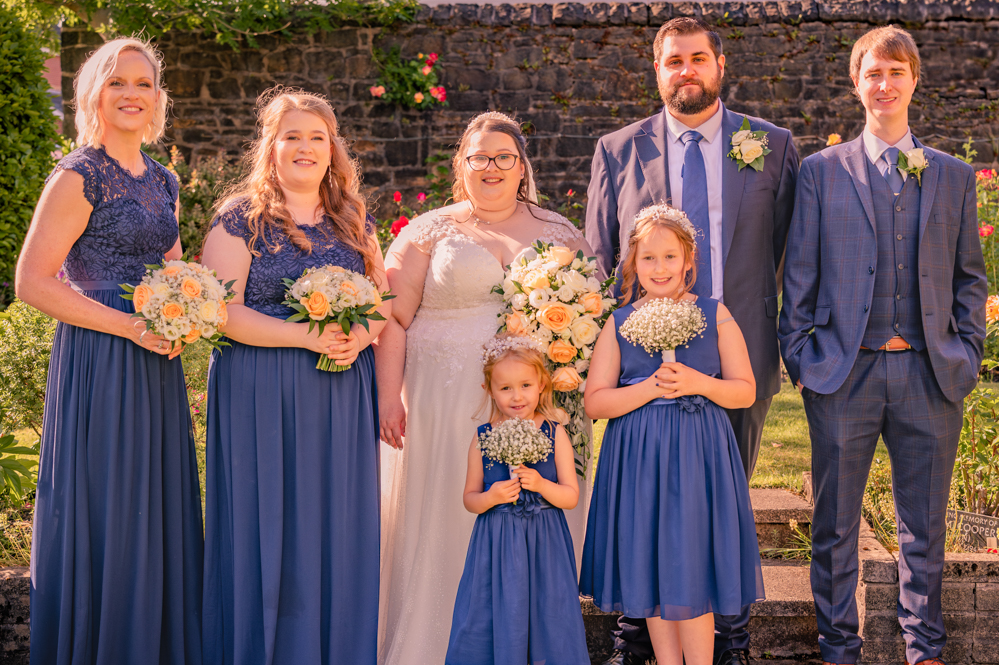 Bride and groom with bridesmaids and flower girls