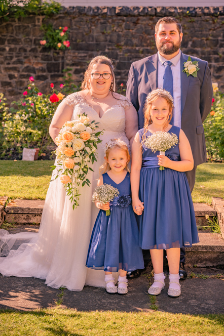 Bride and groom with their two flower girls